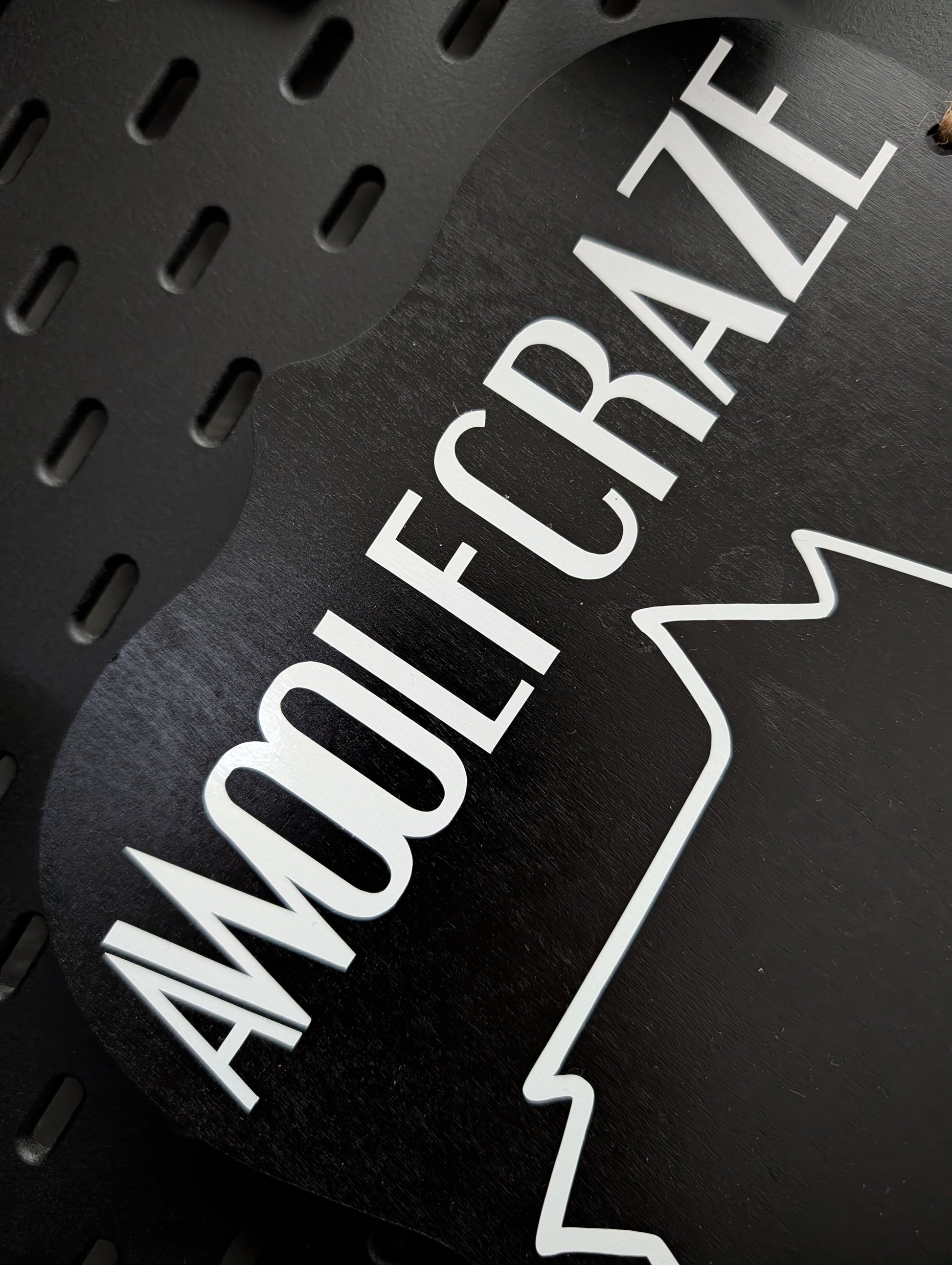 Black product with 'AWOOLRCRAZE' branding on a dark background